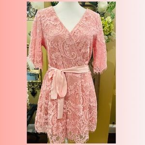 Francesca's pink lace romper long sleeve and shorts with belt and ties in back.